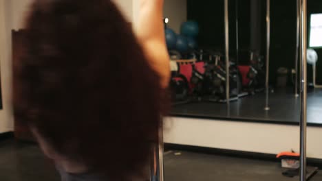 pole dancer practicing pole dance