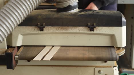 drum sanding two strips of maple wood