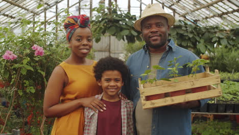 portrait of african american family in greenhouse