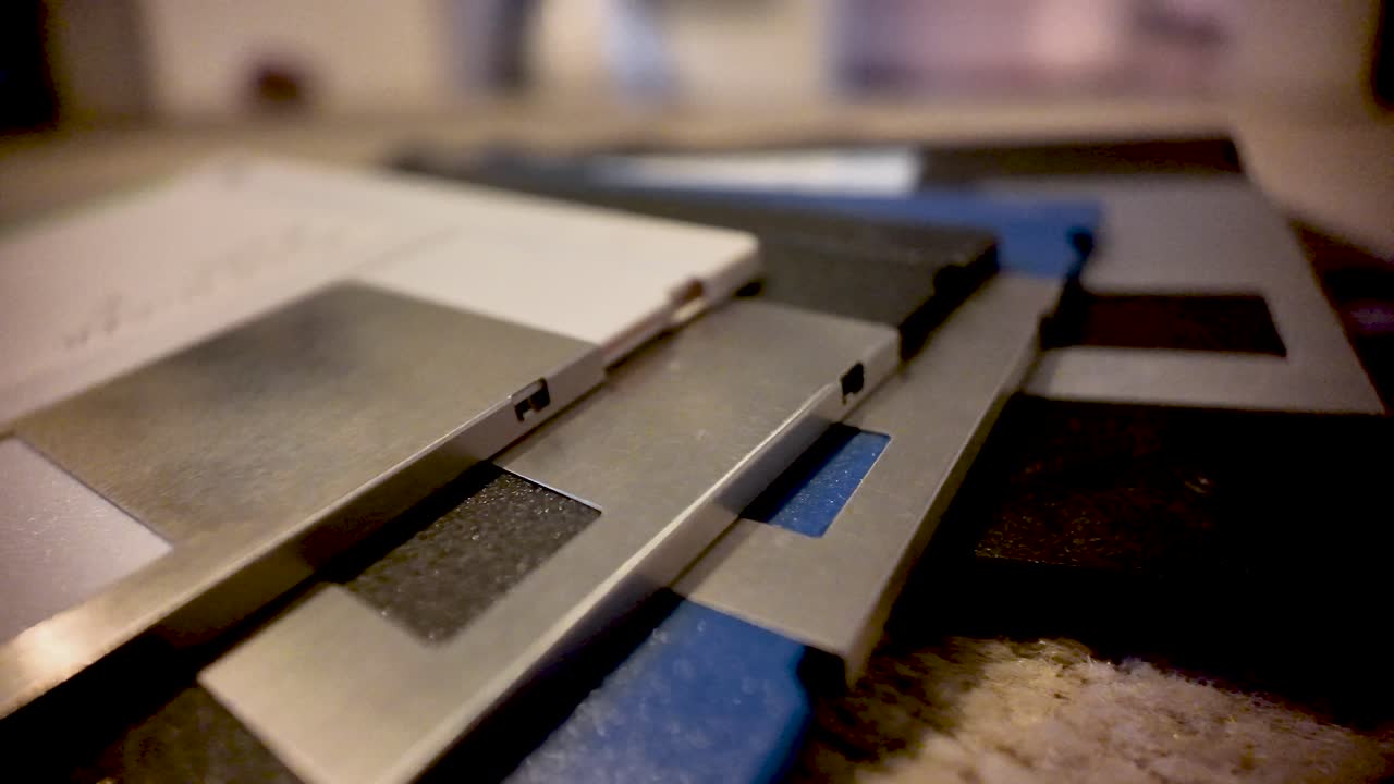 Close up view of stacked floppy disks, representing vintage computer data