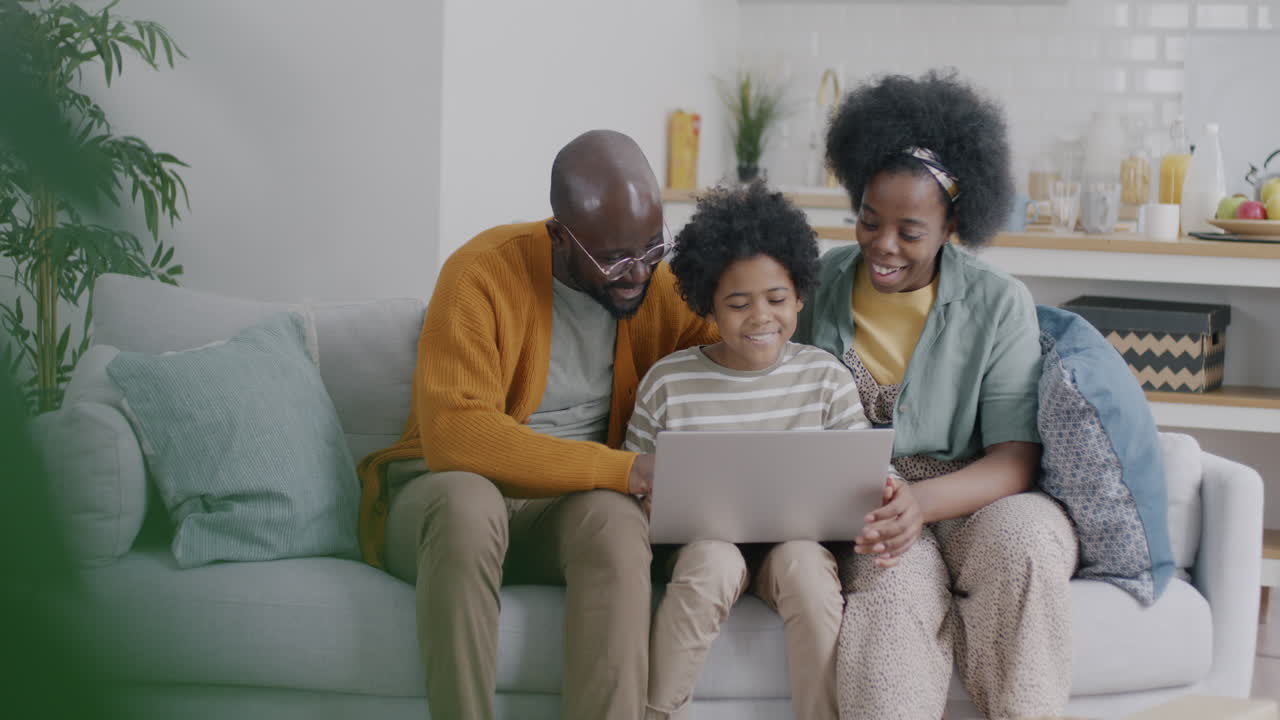 Family Using Laptop Together