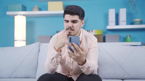 Young-man-finding-a-good-idea-on-the-phone.-Thinking,-Opportunity.