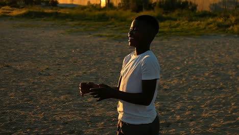 boy playing in the playground with football 4k