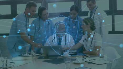 animation of padlock icon over diverse doctors using tablet in hospital