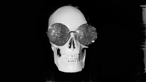 human skull with sunglasses