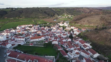 odeceixe village aerial view, portugal's serene coast - aerial flyover