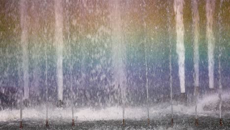 colorful rainbow forms in fountain water spray