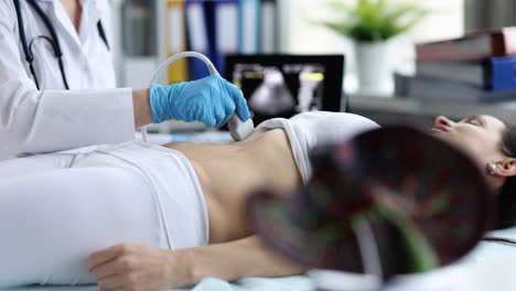doctor performing an ultrasound examination on a patient
