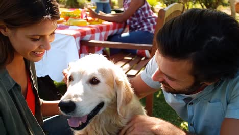 smiling couple with the dog