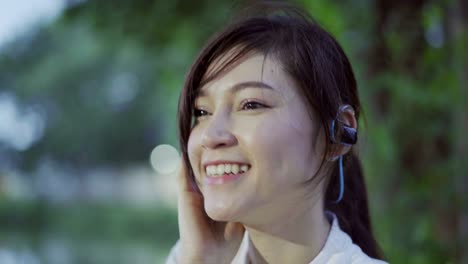 sporty woman listening to music with wireless headphones