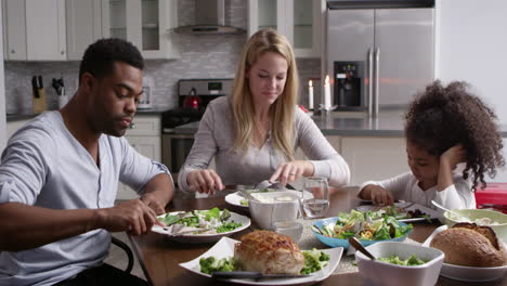 girl and her mixed race parents dining in their kitchen, shot on r3d