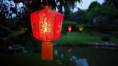 Red Chinese Lantern in a Garden at Night