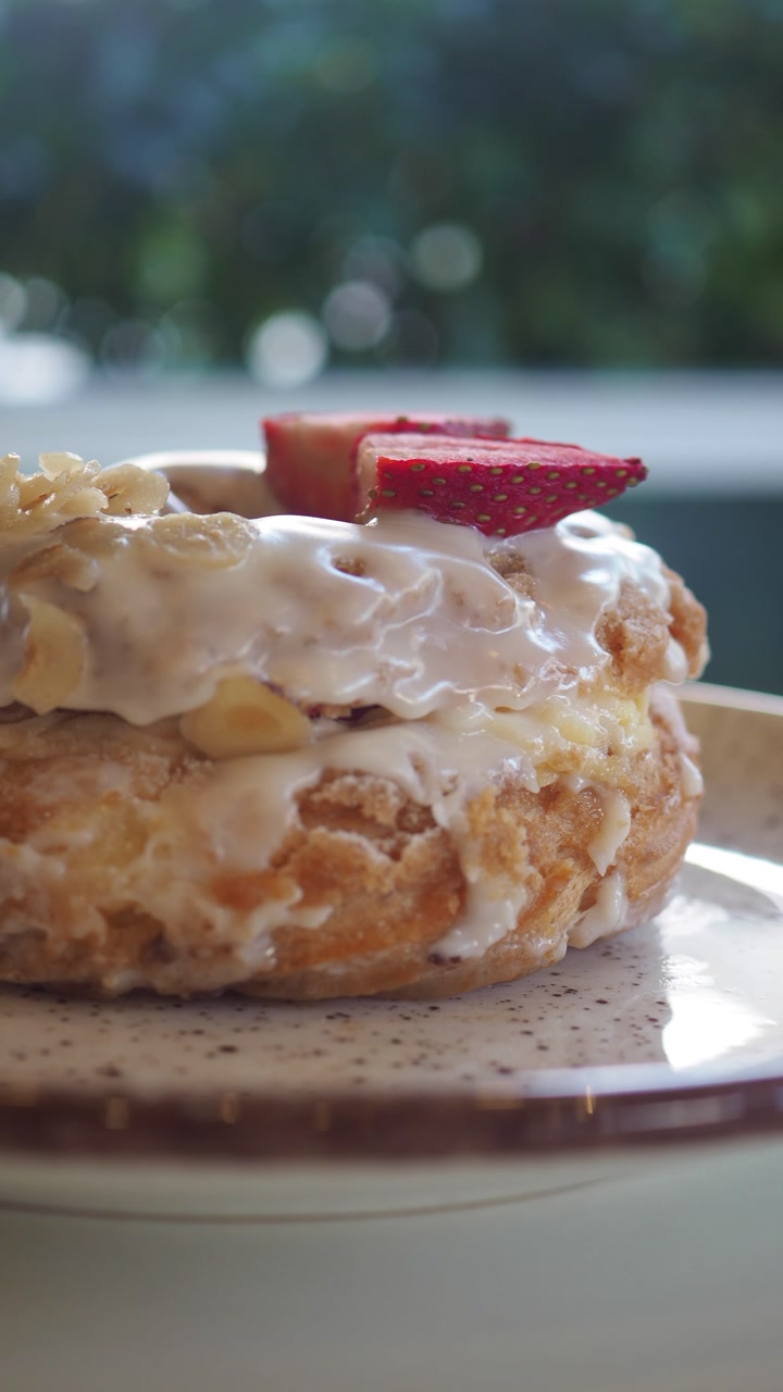 Close-up of a Delicious Cream Puff with Strawberries and Icing
