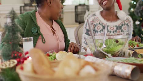 happy african american family having christmas dinner