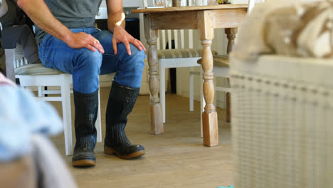 man wearing wellington boot at home 4k