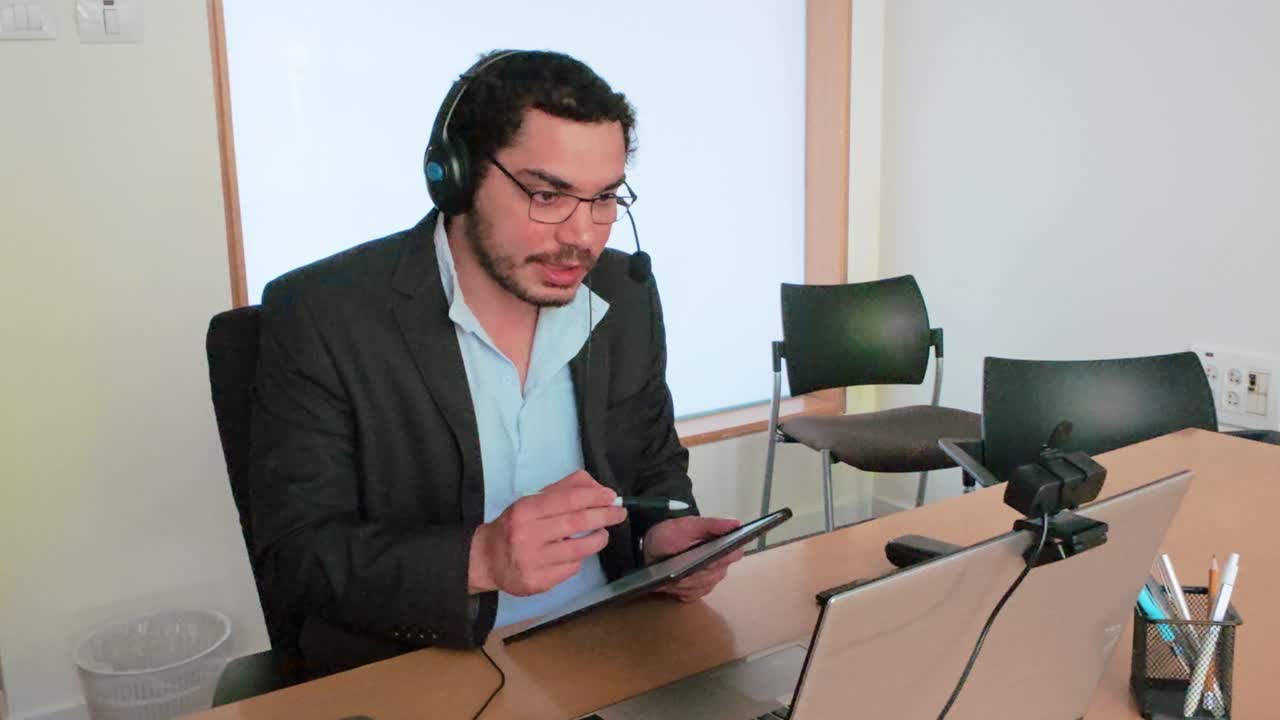 Generating Ideas: Man Using Tablet in Virtual Group