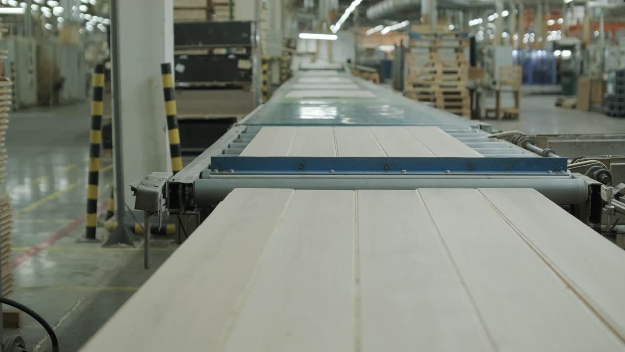 Wooden Planks Moving on Conveyor Belt in a Factory