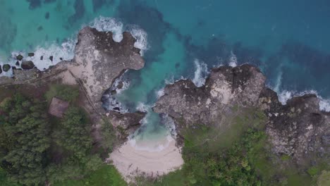 top down shot of pantai mandorak with no people during sunrise, aerial