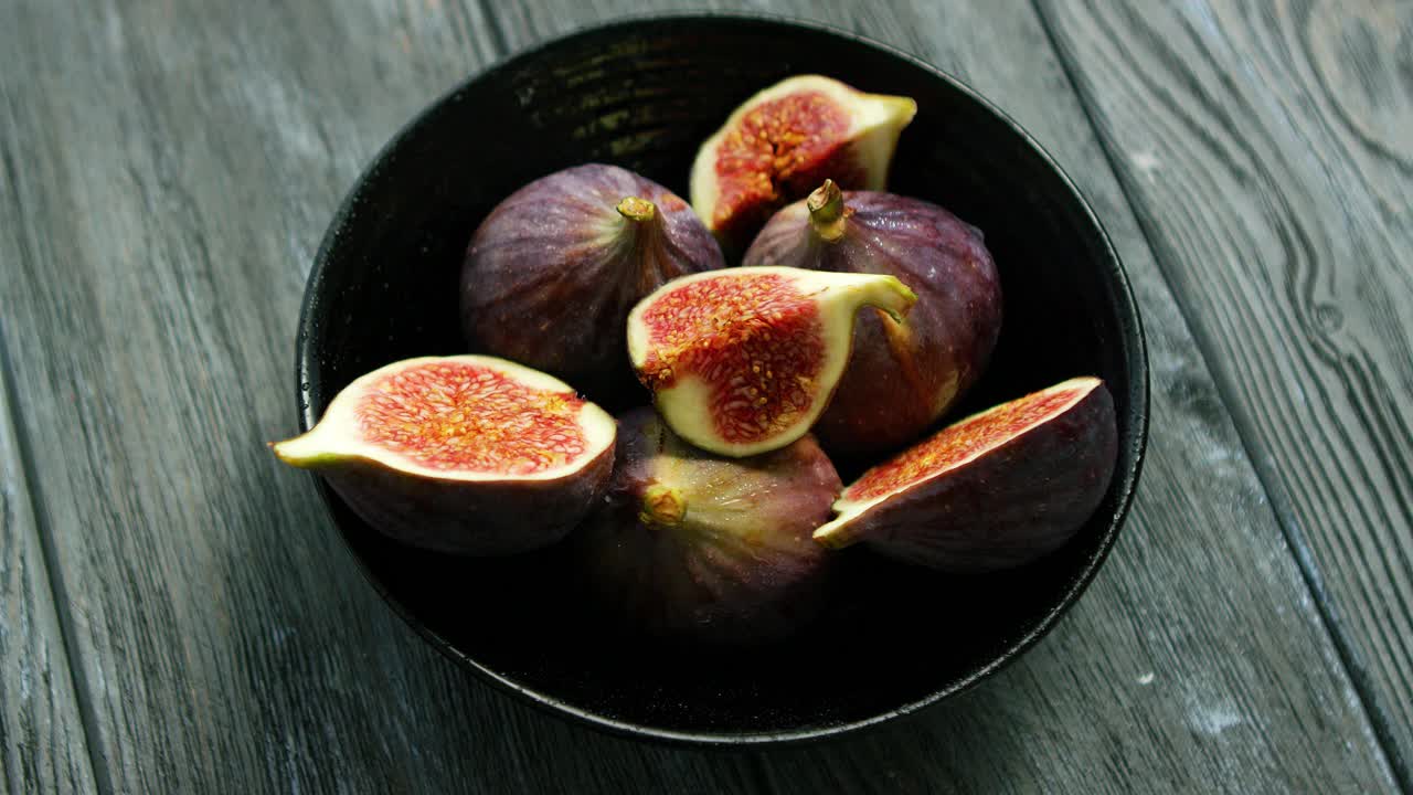 Bowl full of cut figs
