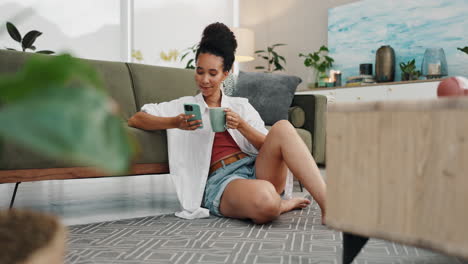 woman relaxing on floor with phone and coffee