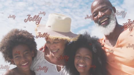 animation of jolly text and happy diverse grandchildren and grandparents on sunny beach at christmas