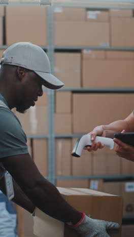 logistics workers managing inventory and handling packages in a warehouse