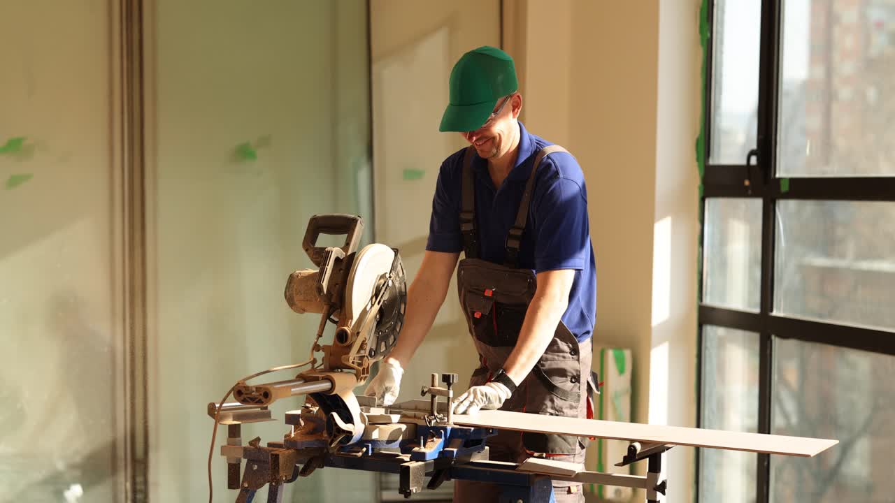Man working with a miter saw on a construction site