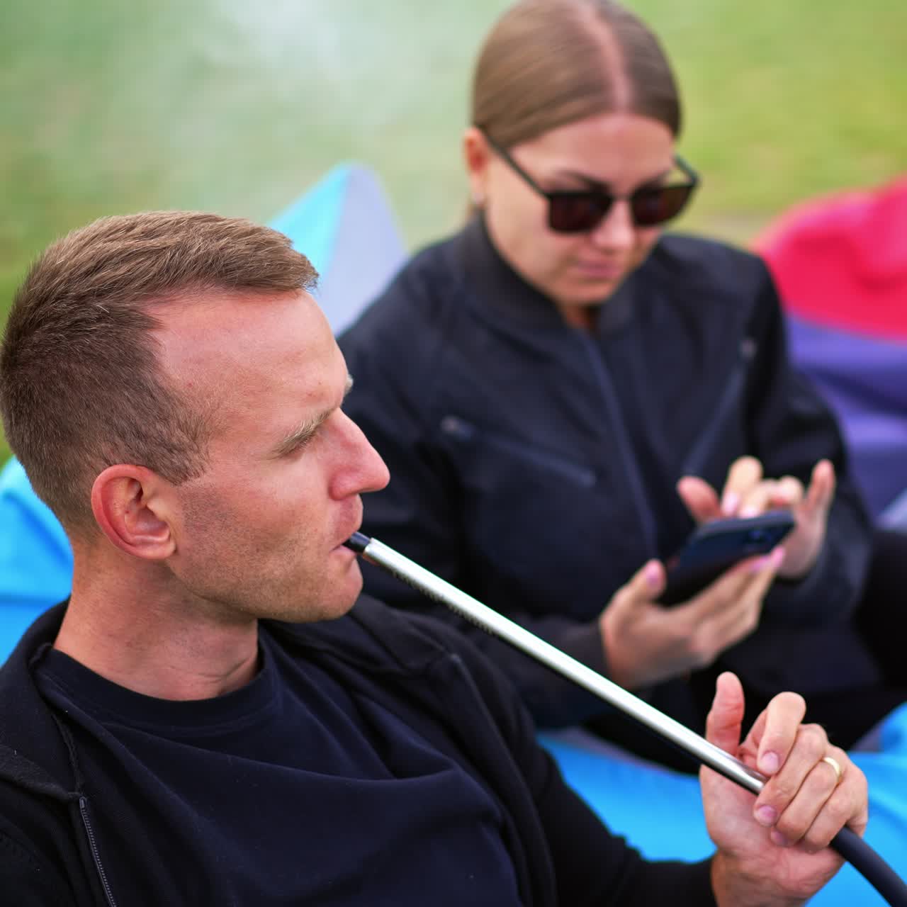 Hookah outdoor summer lifestyle. Sunny days smoking in the park