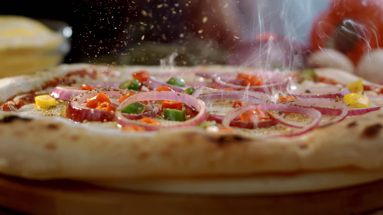Close-up of a delicious pizza with onions and peppers