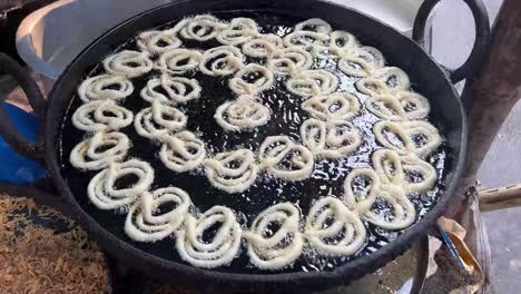 fresh jalebi or jilebi jangri made at a roadside stall in india during mela