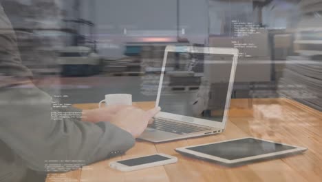 animation of man using laptop with data processing over warehouse