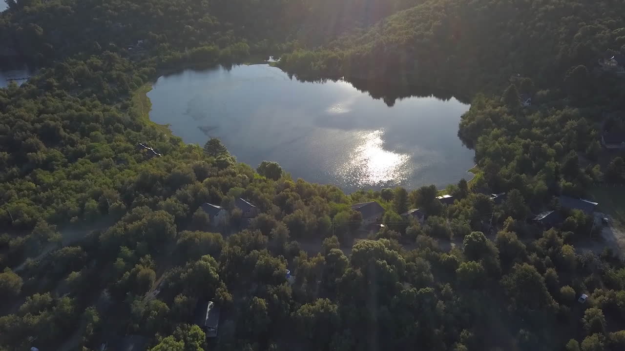 AERIAL - Small lake in the middle of a forest, Neuquen, Patagonia, Argentina, forward