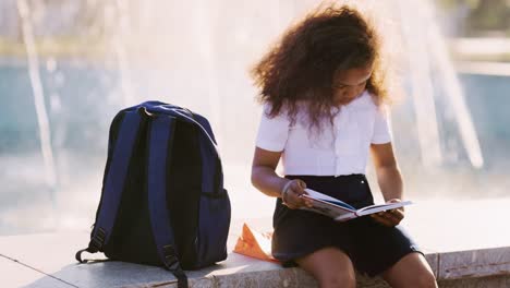 student reading outdoors