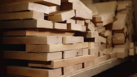 stacked wood planks in a workshop