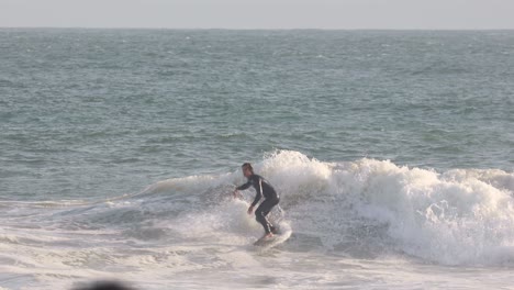 fun roundhouse at the junction in a good surfing day, carcavelos, cascais