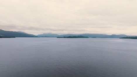 Ascending-Pedestal-Shot-Of-Loch-Lomond-On-A-Cloudy-Day