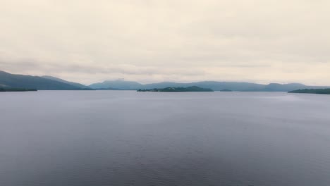 ascending pedestal shot of loch lomond on a cloudy day