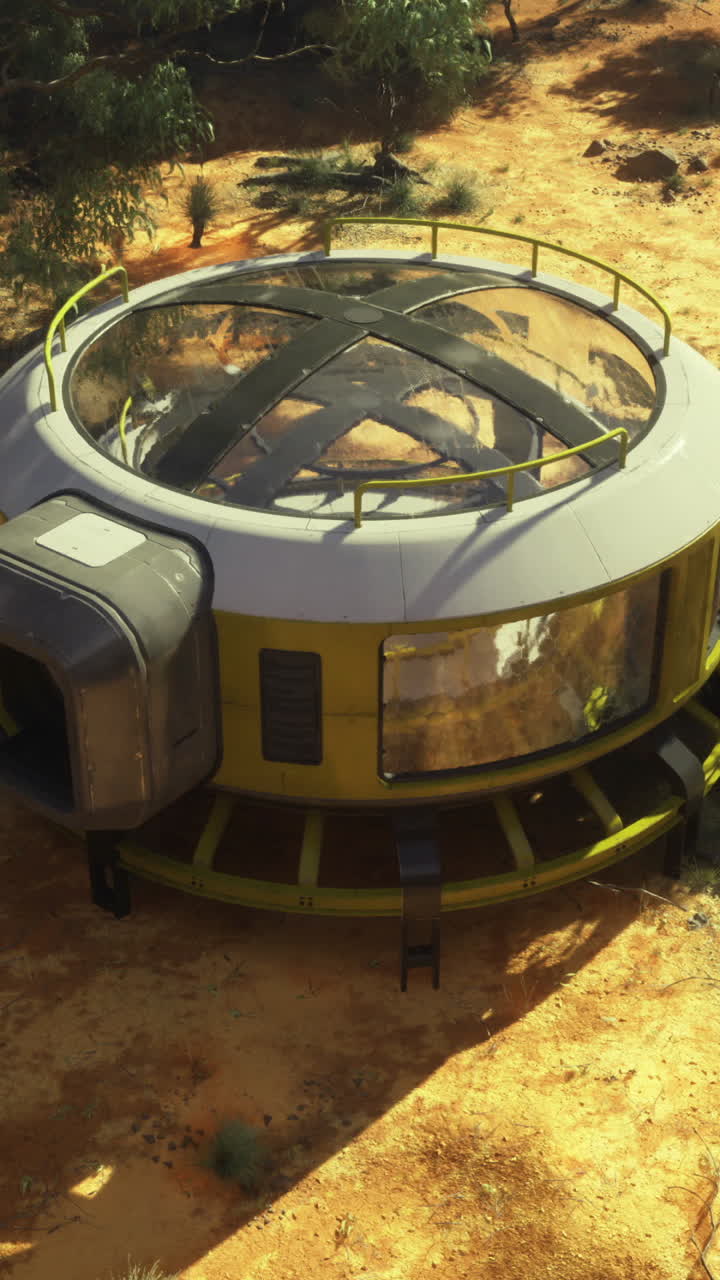 Modern circular structure in desert landscape surrounded by greenery