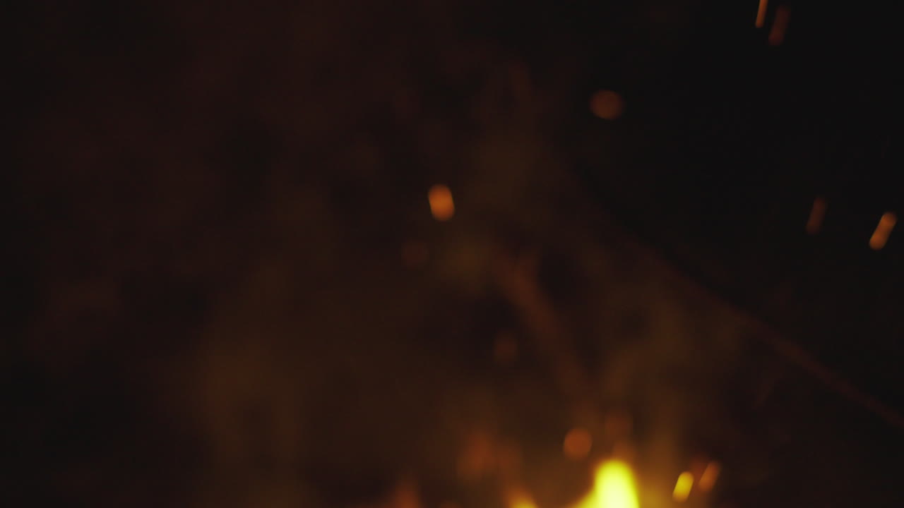 Fire Sparks and Smoke at Night