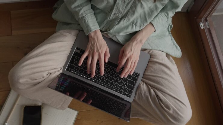 Woman Working on Laptop at Home
