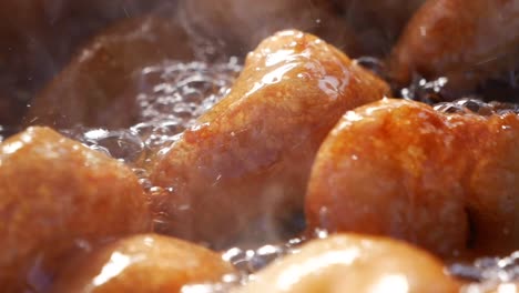 fried doughnuts in hot oil