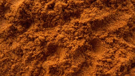 portion of paprika powder rotating