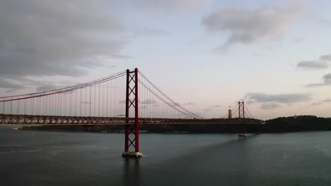 the red suspension bridge in the evening