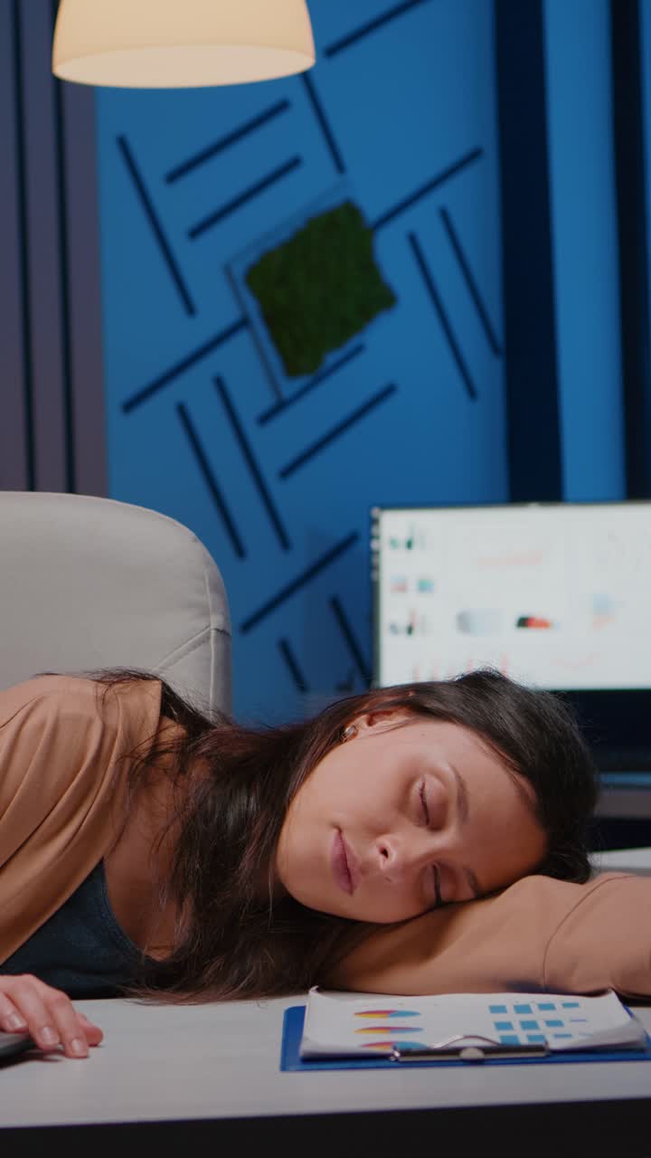 Vertical video Businesswoman sleeping while working at accounting statistics in company office