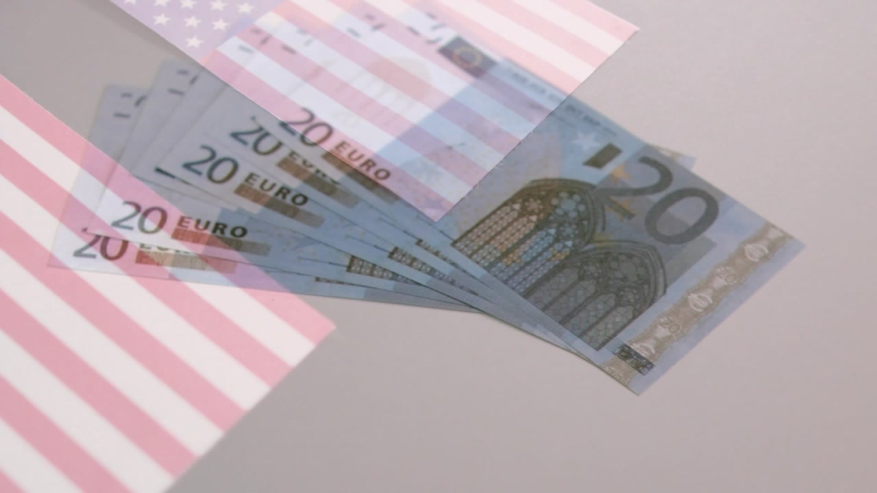 Animation of hexagonal shapes design pattern over american flags and euro bills