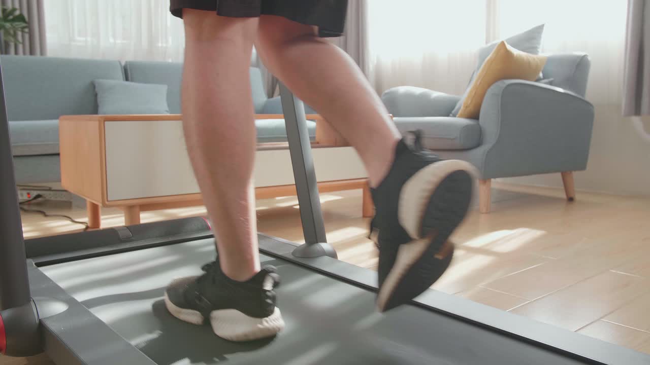 Man Walking on a Treadmill at Home