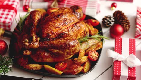 roasted whole chicken or turkey served in iron pan with christmas decoration