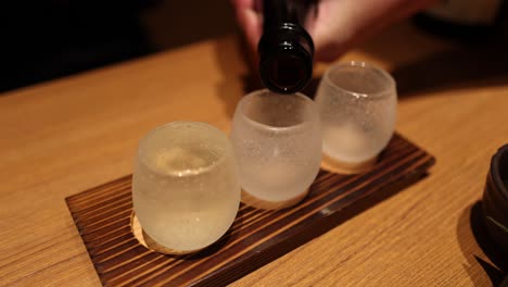 sequence of beer being poured into two glasses