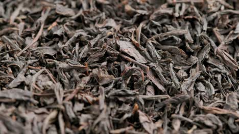 looped spinning dry black tea full frame close-up background