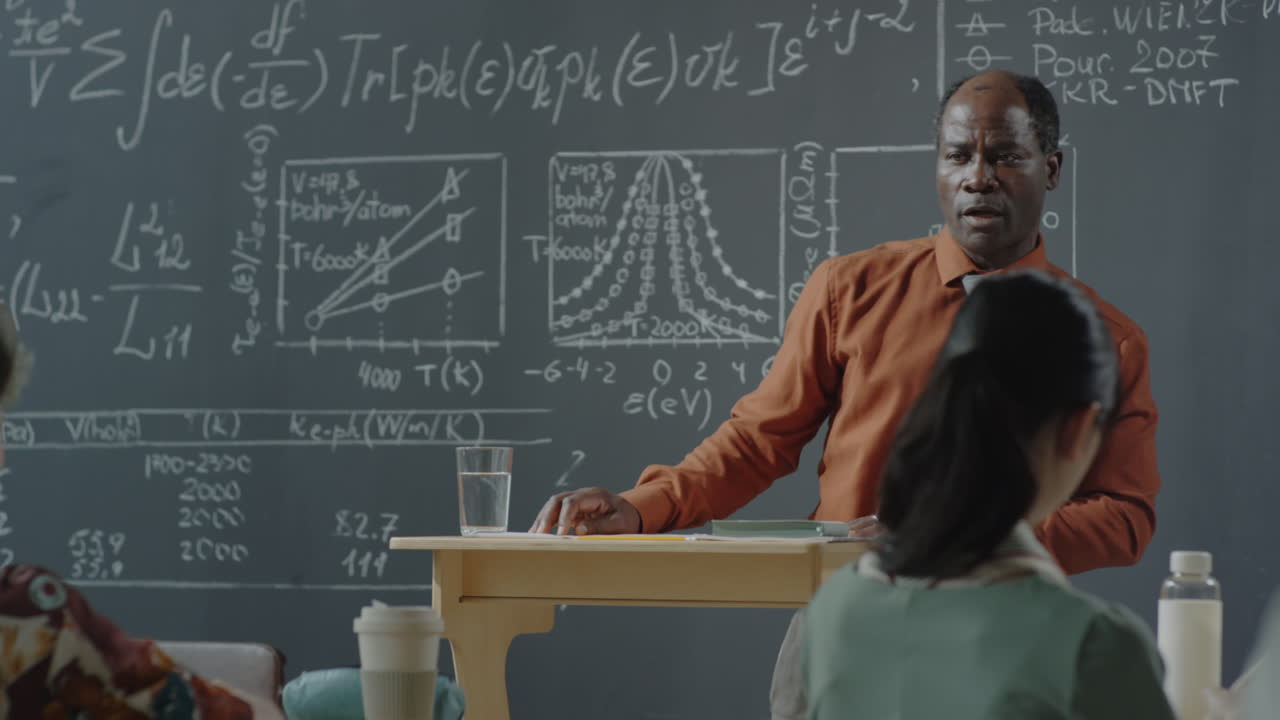 African American Professor Lecturing in a University Classroom